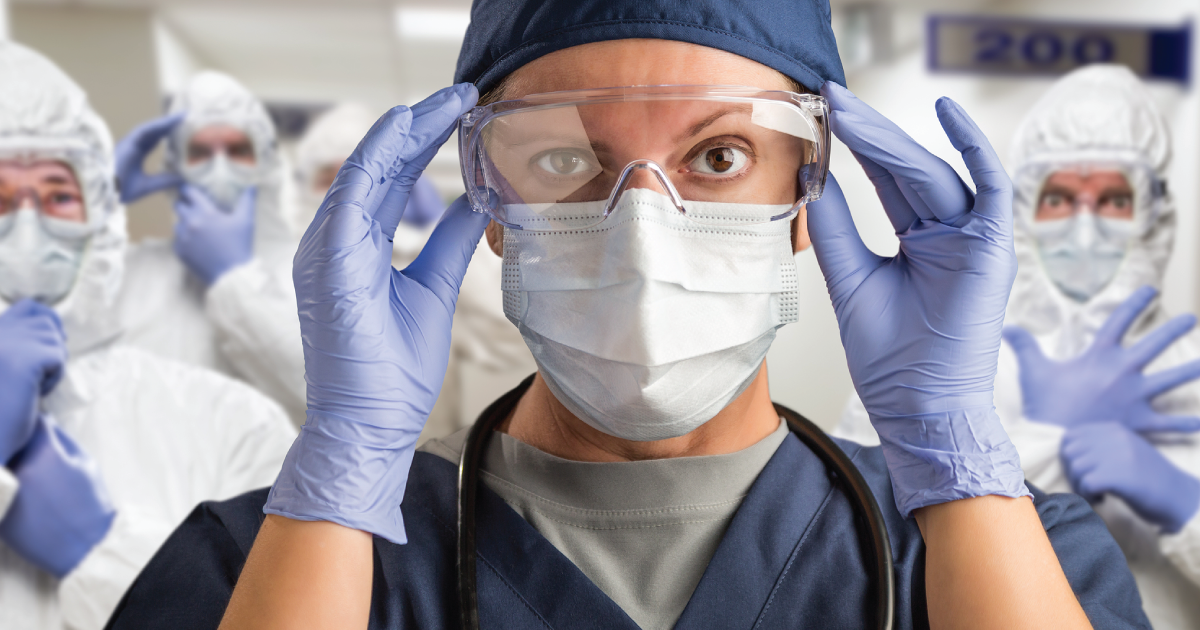 Woman with a mask working in a medical setting.
