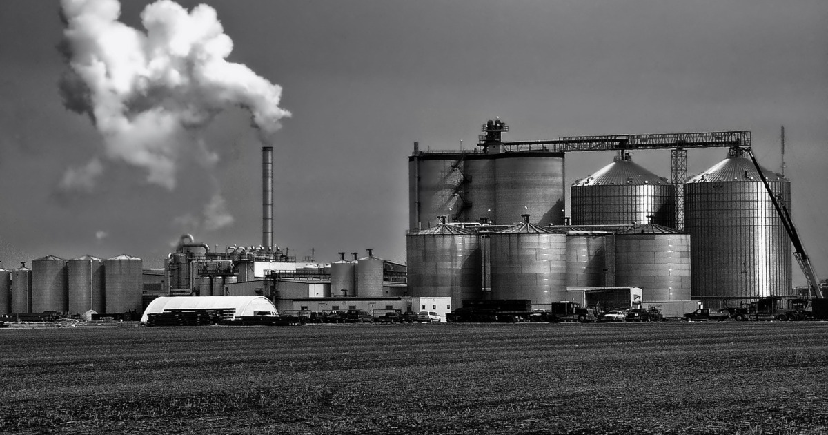 ethanol plant with farm field in foreground