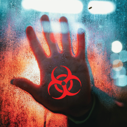 hand against glass with the biohazard symbol