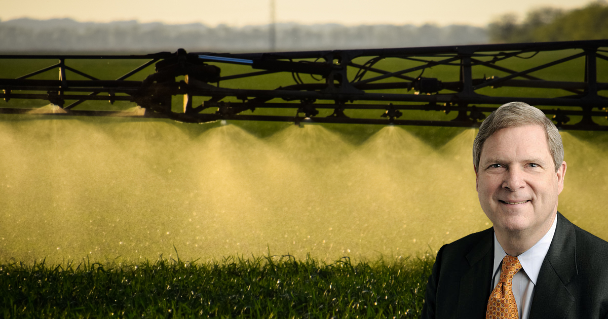 Tom Vilsack and spraying pesticides on a farm field crop